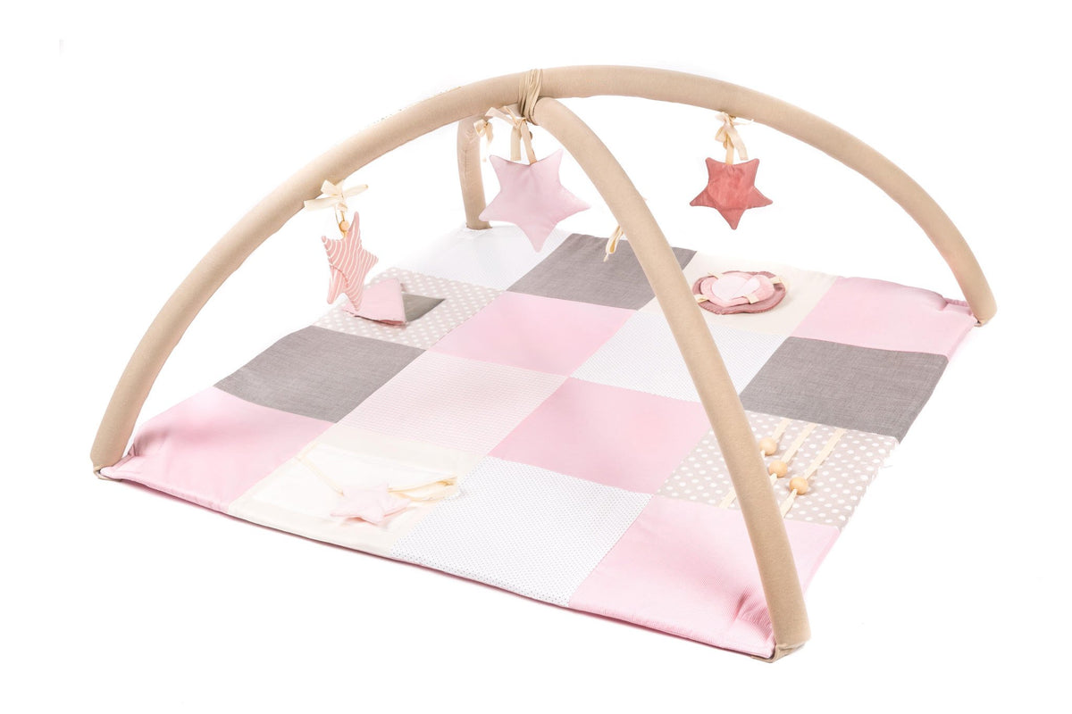 1. Karloova pink baby activity mat with arches and star toys in a patchwork design