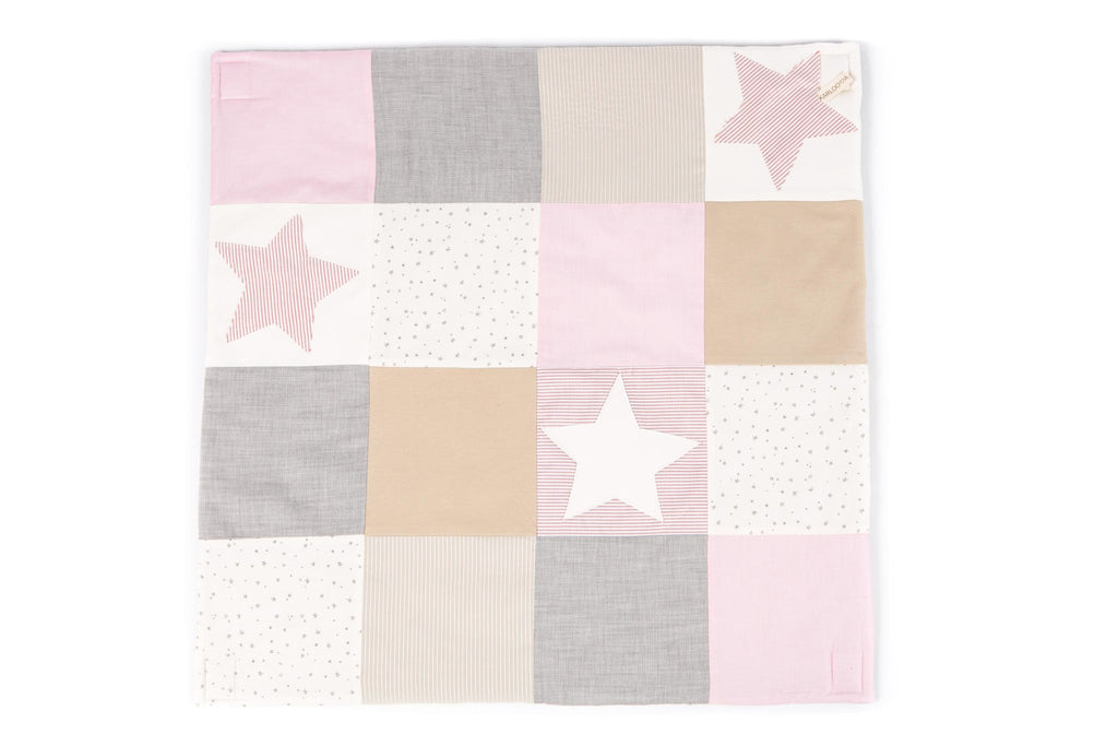 4. Flat lay of Karloova pink patchwork baby activity mat with star patterns