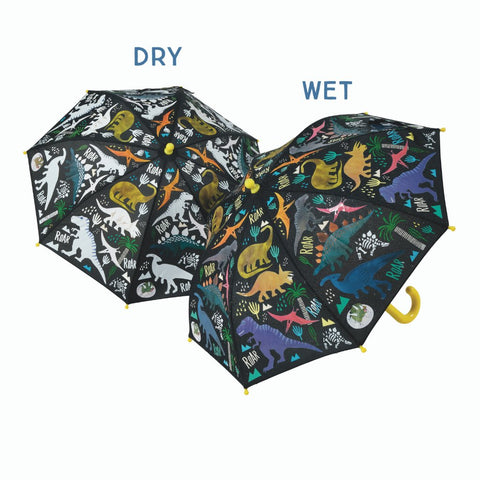 1. Children's transparent color-changing 3D umbrella with dinosaur motifs, shown in dry and wet states, featuring colorful designs when wet and white when dry, with yellow handle and Velcro fastener.