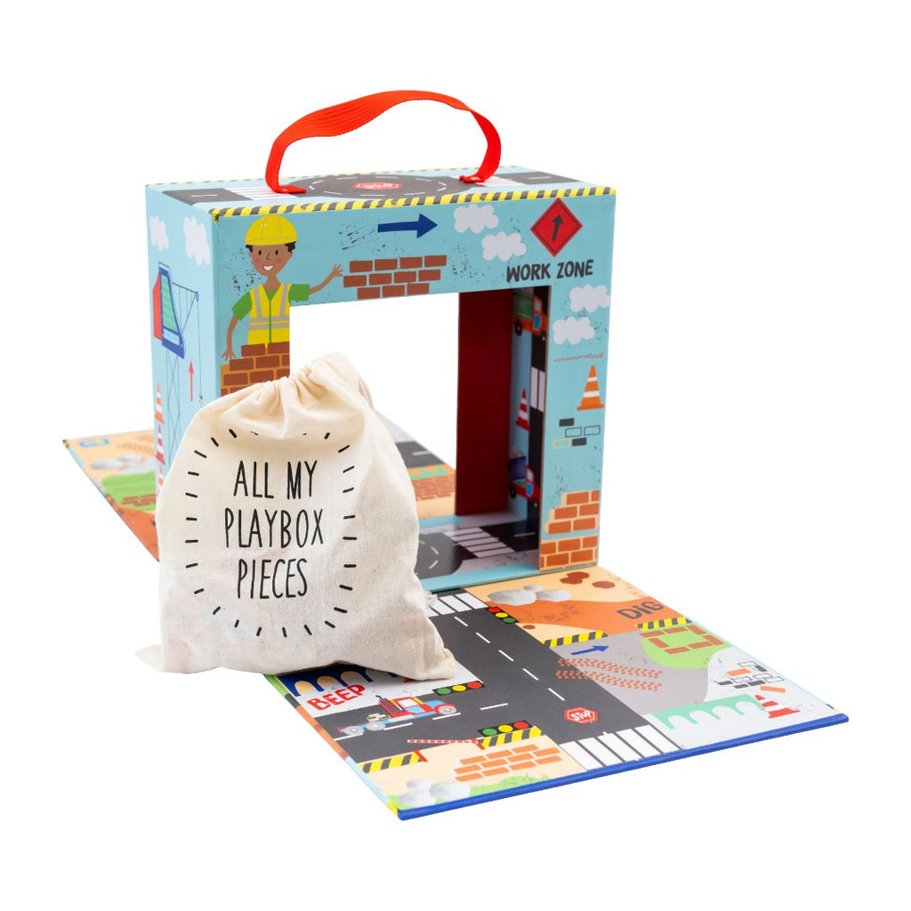 7. Playbox with drawstring bag labeled 'All My Playbox Pieces' on a colorful construction-themed play area