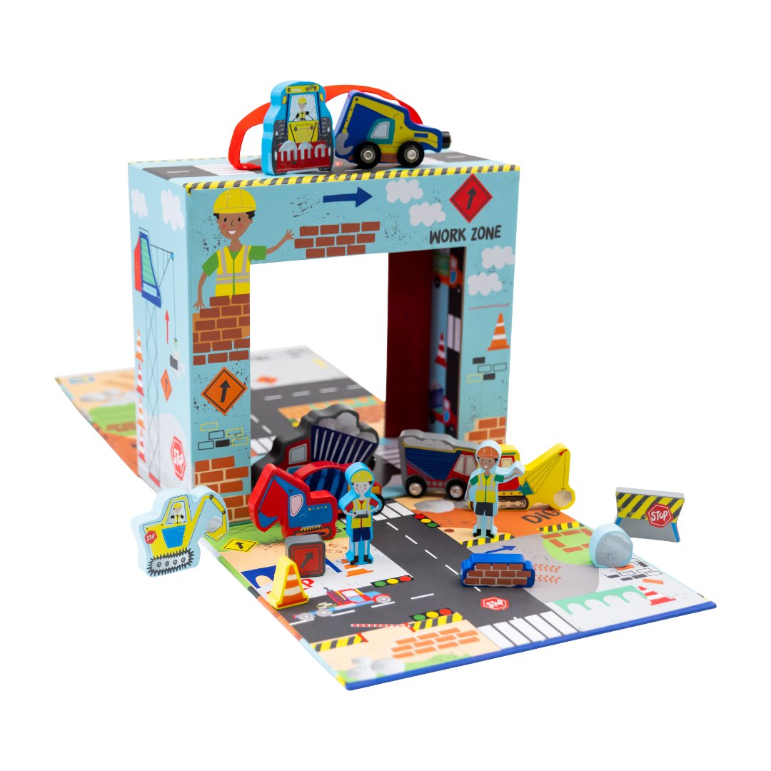 1. Playbox with wooden construction pieces including trucks and diggers on a colorful play area with roads and work zone theme