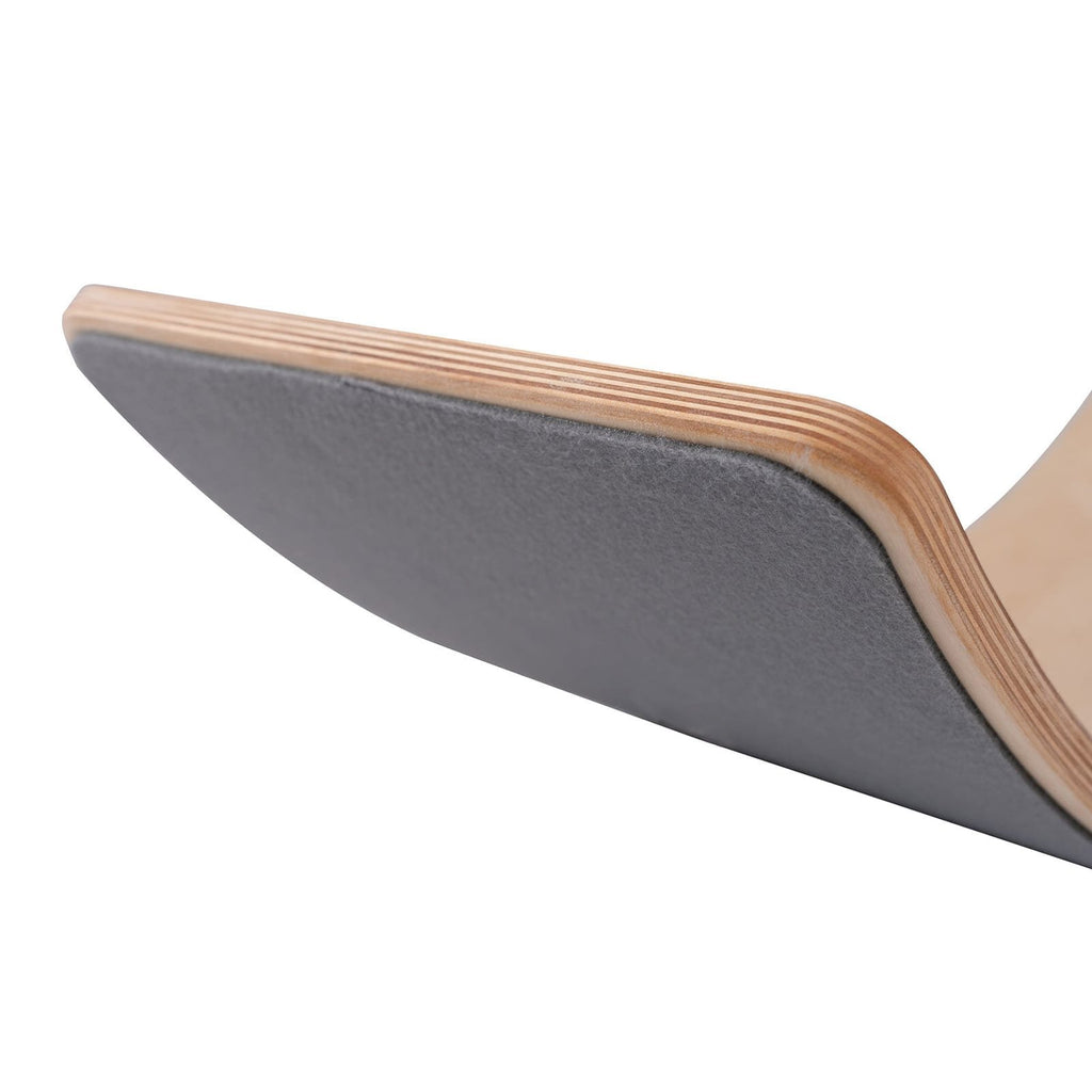 3. Close-up of grey balance board edge, highlighting felt underside