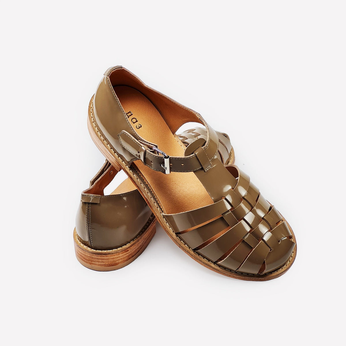 4. Side view of women's handmade beige leather fisherman sandals with round toe and stacked heel