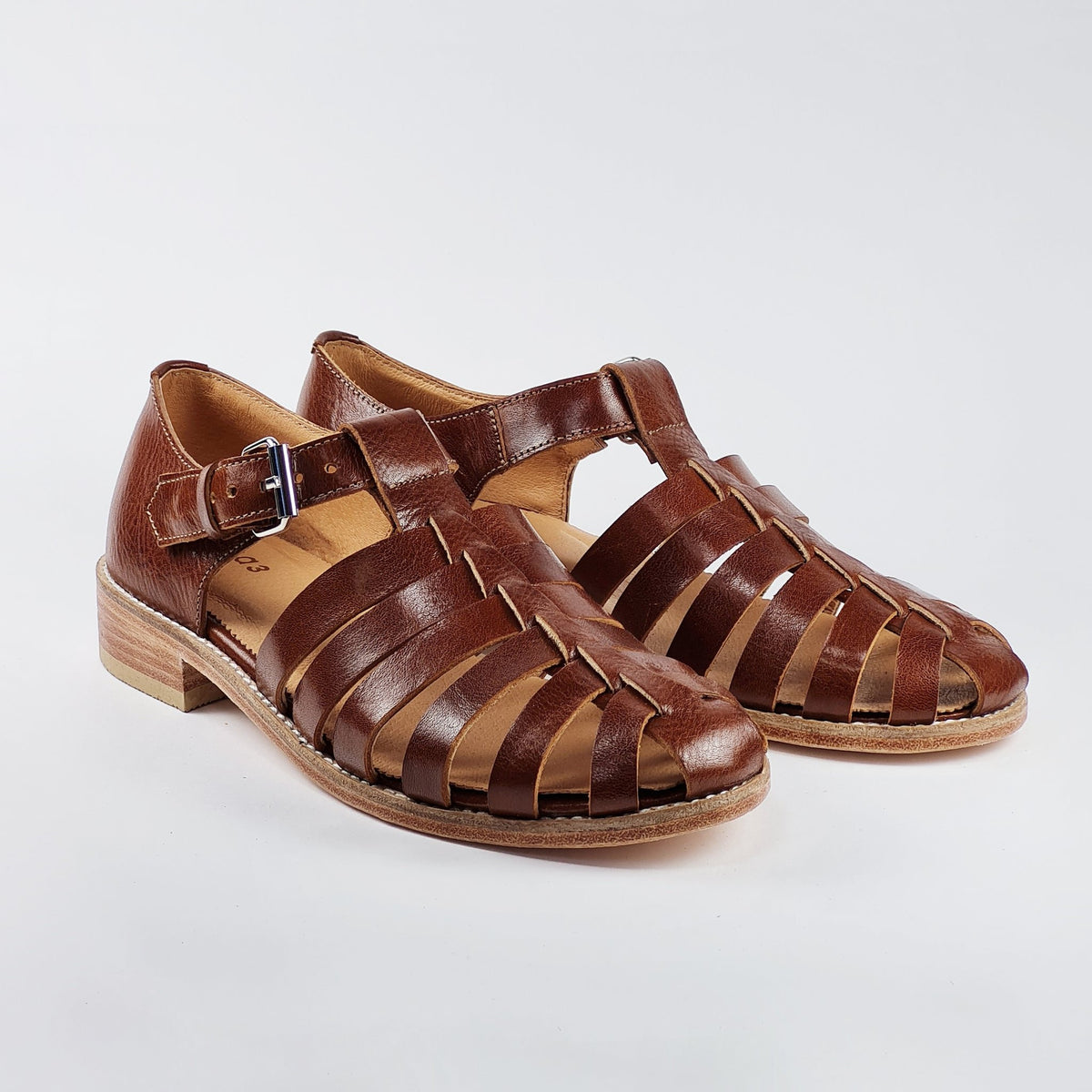 3. Handmade brown leather fisherman sandals by Daz Studio, shown in a studio setting with adjustable strap