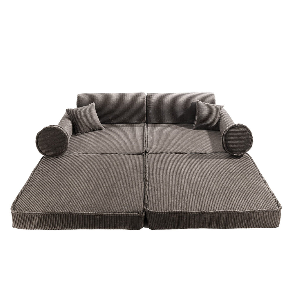 2. Brown corduroy modular sofa fully unfolded into a flat position with cushions