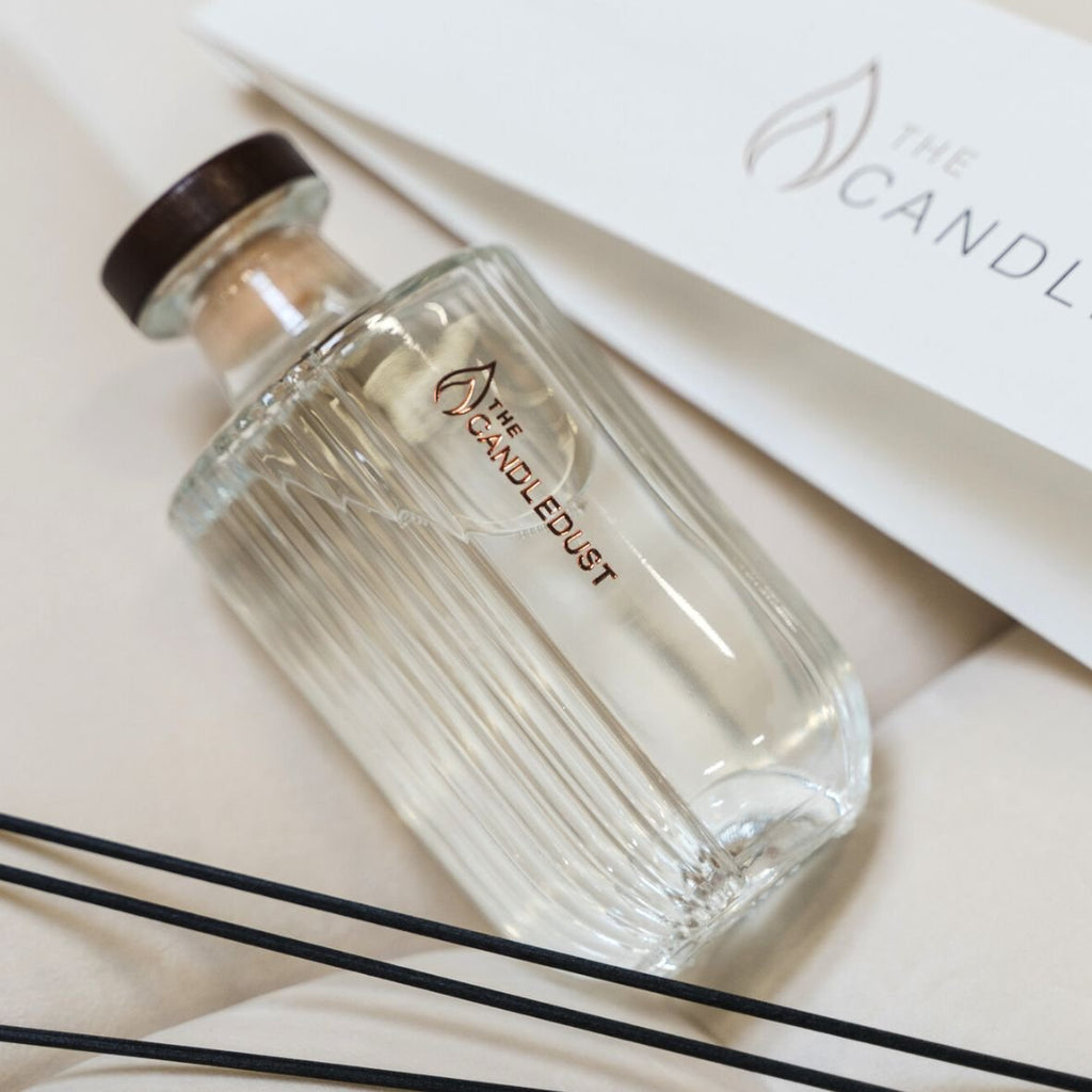 7. Close-up of Candledust Breeze diffuser bottle with brand logo and black reeds
