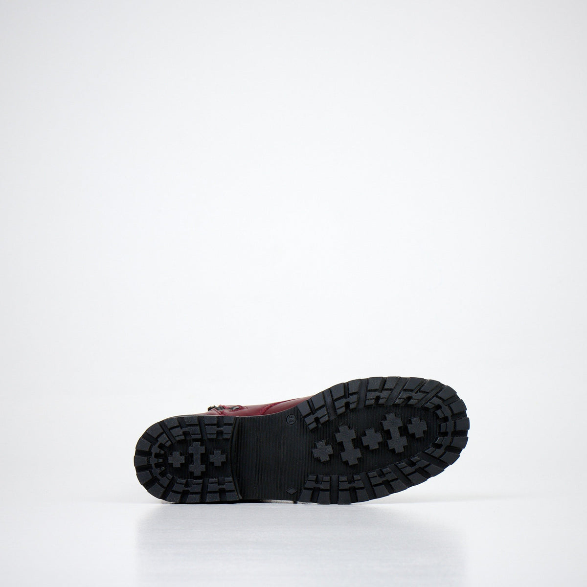 6. Sole view of unisex burgundy winter boots by Samelin, showing tread pattern
