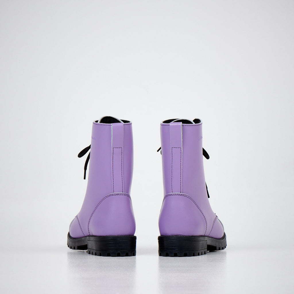 2. Back view of unisex purple leather boots with black laces and rugged sole on white background