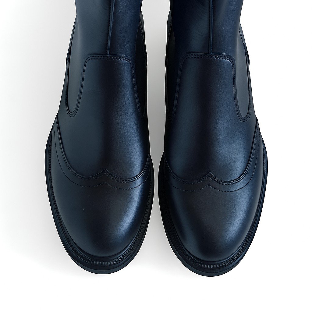 3. Close-up top view of black high nappa leather boots showing toe and stitching details