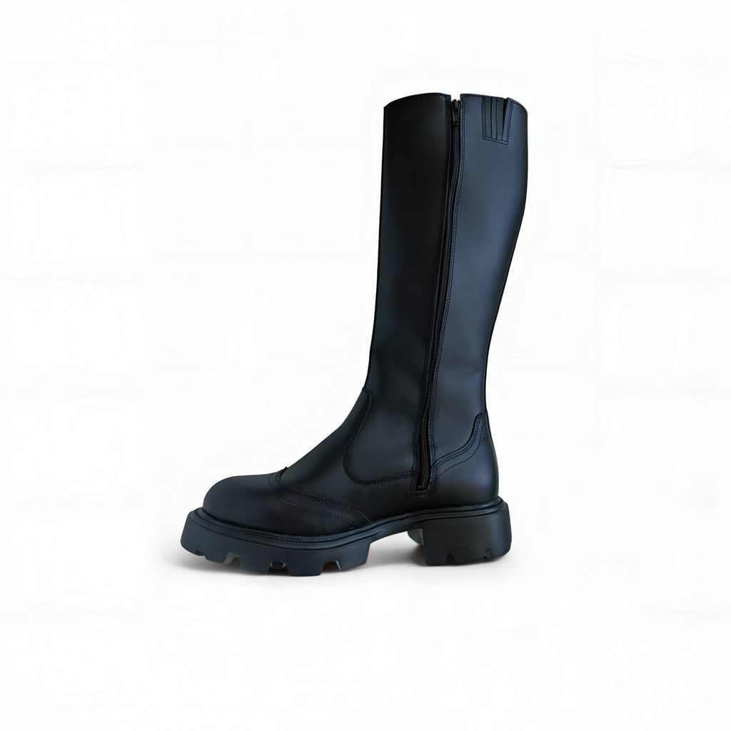 2. Black high nappa leather boot with side zipper and chunky sole shown in studio on white background
