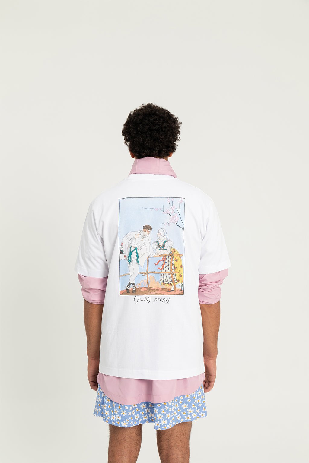 6. Back view of Hopera's 'Gentils Propos' t-shirt worn by male model, showcasing George Barbier's art