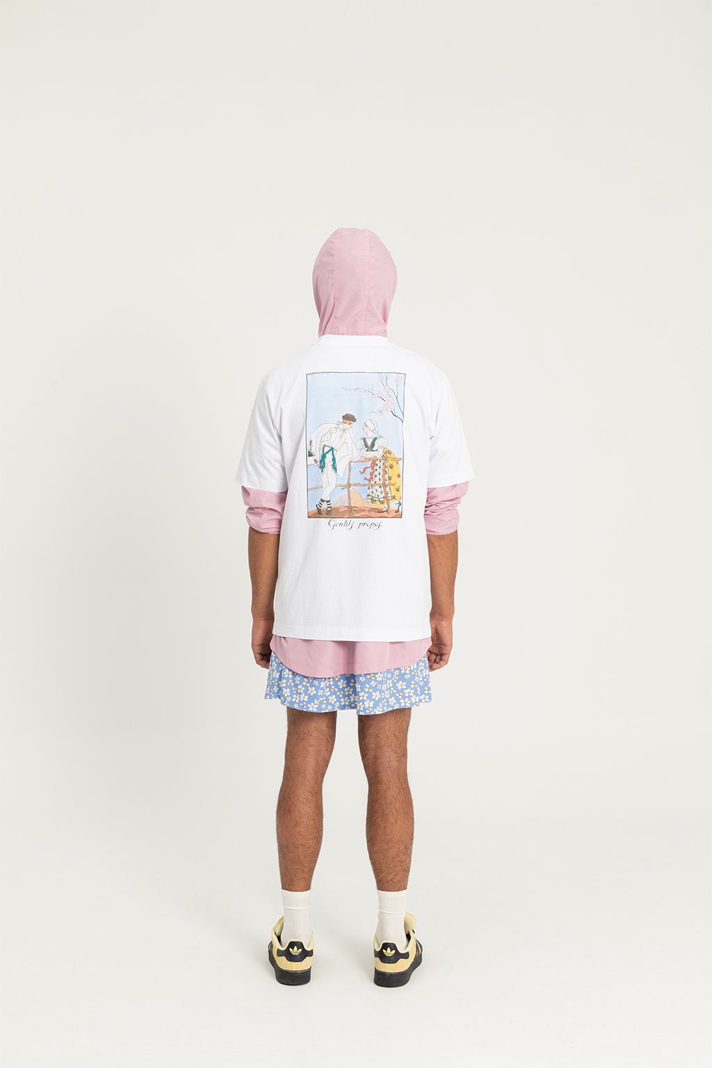 5. Studio shot of male model in Hopera's 'Gentils Propos' t-shirt, highlighting back illustration