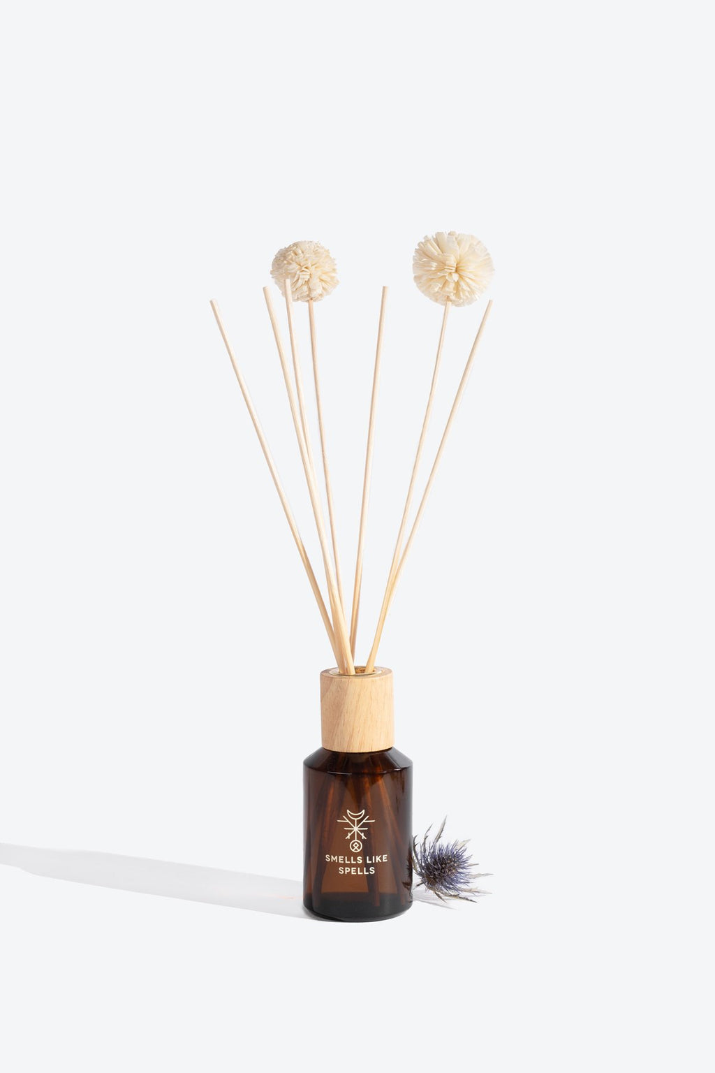 4. Smells Like Spells HEIMDALLR home perfume in brown glass bottle with reed diffuser sticks, close-up view