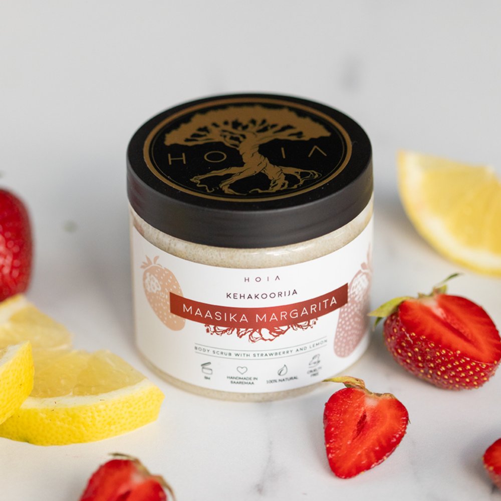 4. Open jar of HOIA homespa Strawberry Margarita body scrub with fresh strawberries and lemon slices