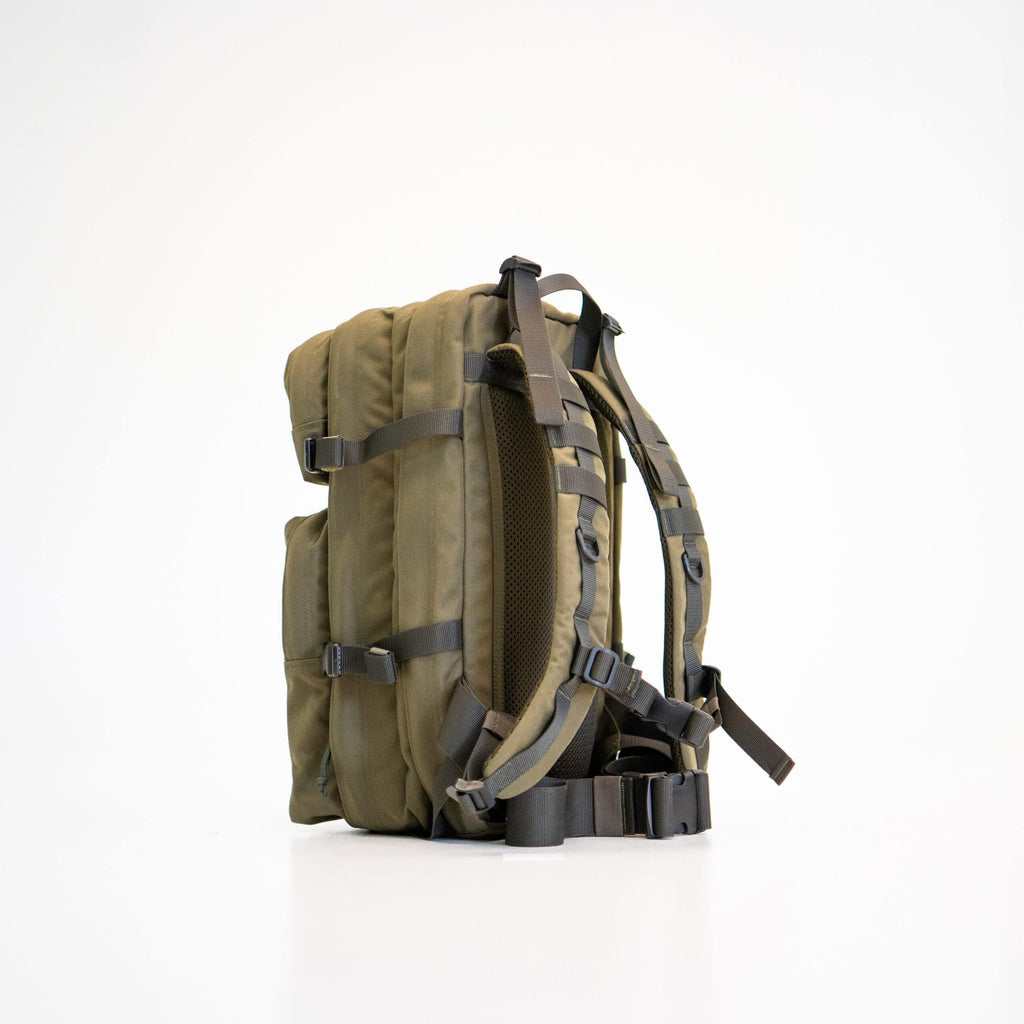 3. Side view of Galvi Linda Backpack 063 in military green, showing adjustable hip support and compression straps, studio setting