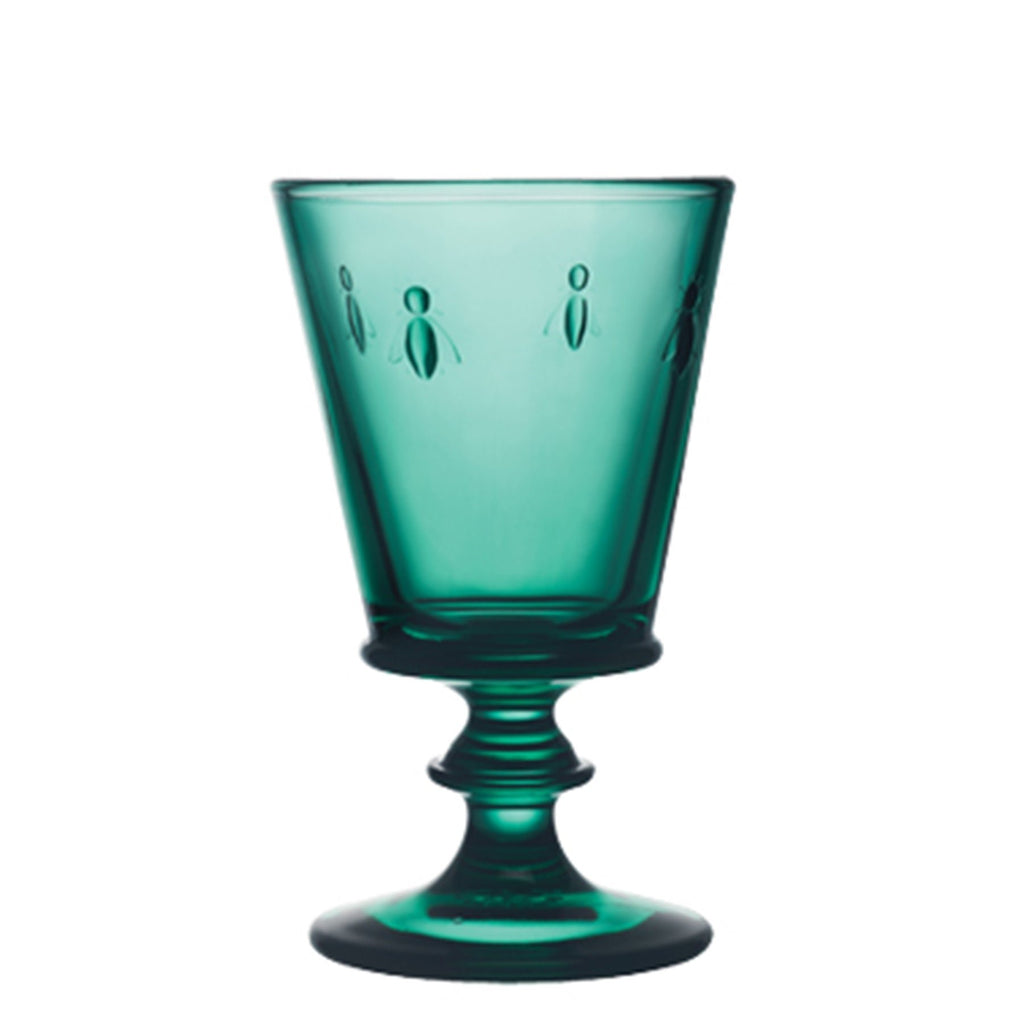 2. Single emerald green La Rochère Bee Glass with embossed bee motif on a white background