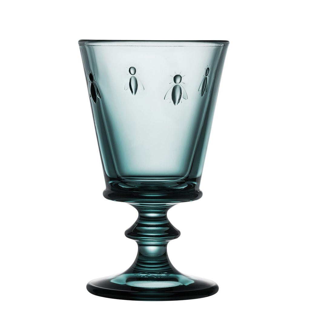 4. Single blue La Rochère Bee Glass with embossed bee motif on a white background