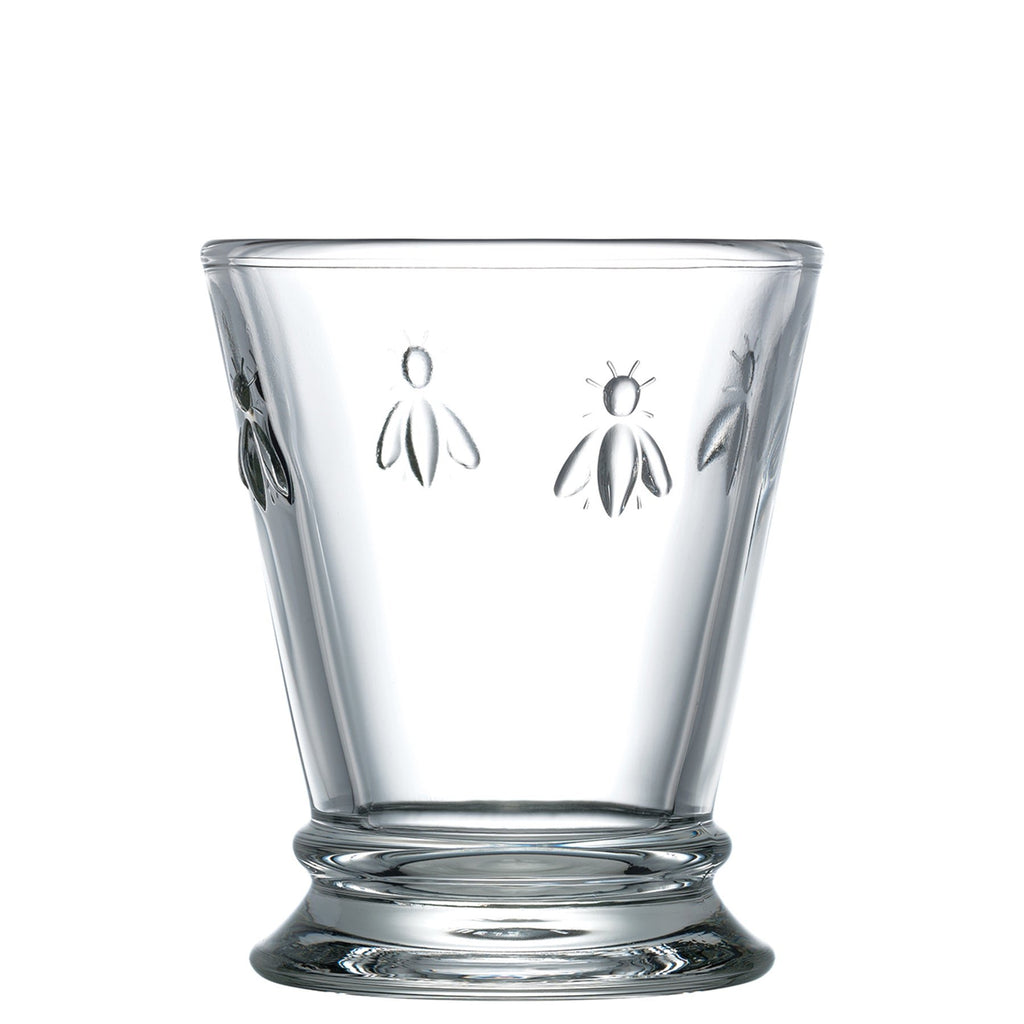 2. Studio shot of a single La Rochère Bee water glass with embossed bee motif on a white background