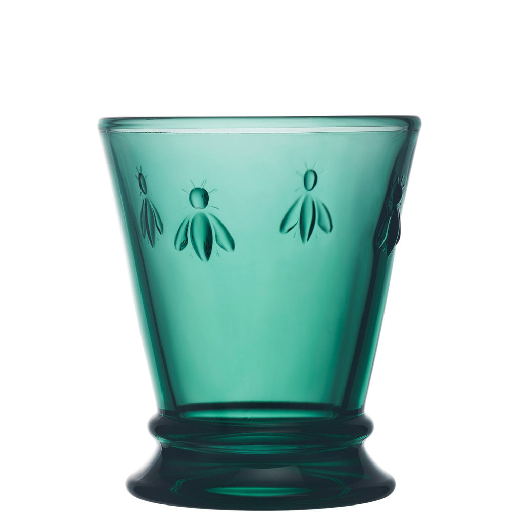 5. Single La Rochère Bee Water Glass in emerald with embossed bee motif, shown in studio lighting