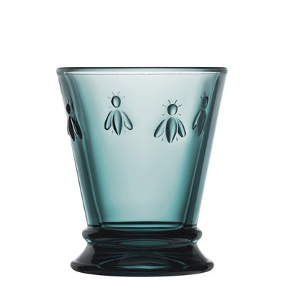 3. Single La Rochère Bee Water Glass in blue with embossed bee motif, shown in studio lighting
