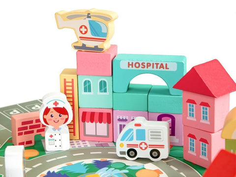 3. Close-up of wooden hospital blocks with nurse, ambulance, and helicopter on puzzle base
