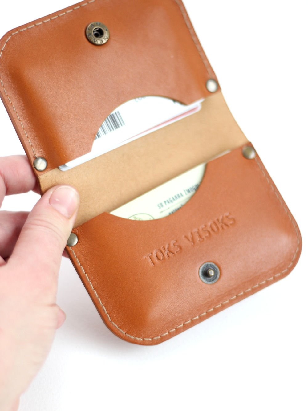 4. Close-up of SUNDAY Wallet in caramel by TOKS VISOKS, displaying card slots and logo