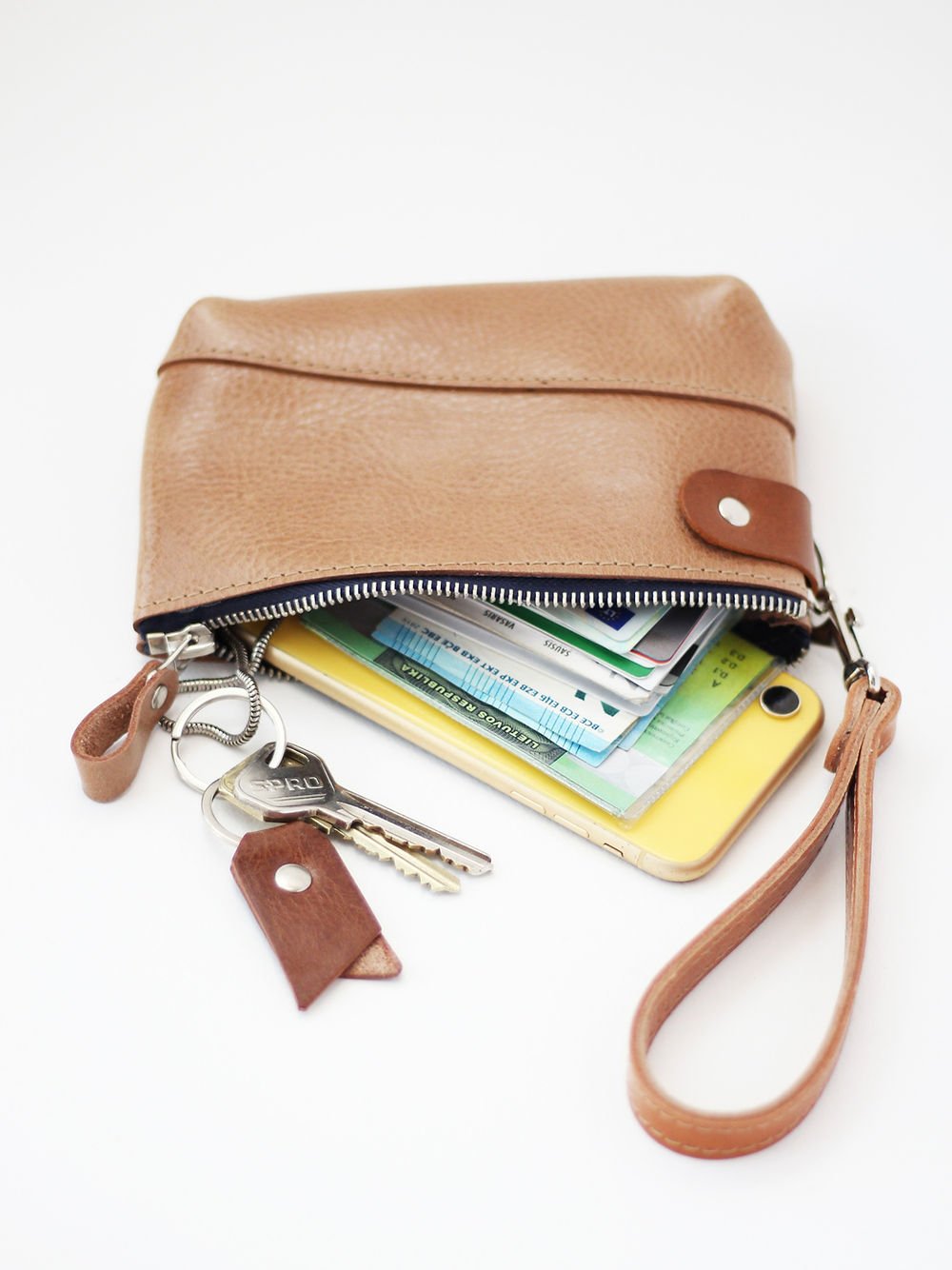 1. TOKS VISOKS brown leather POUCH Wallet with wrist strap, shown with keys and cards inside