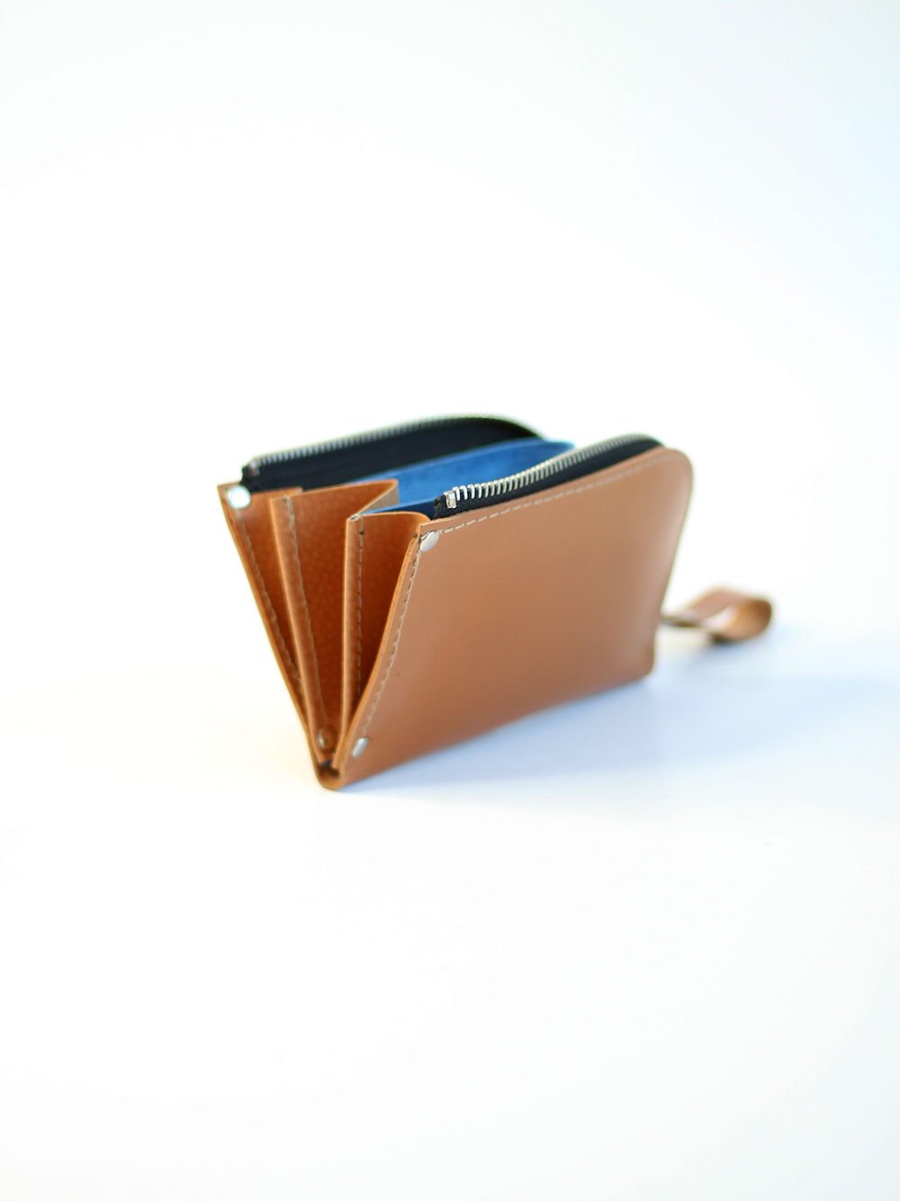 3. Side view of caramel WEDNESDAY Wallet by TOKS VISOKS, highlighting spacious interior and zipper