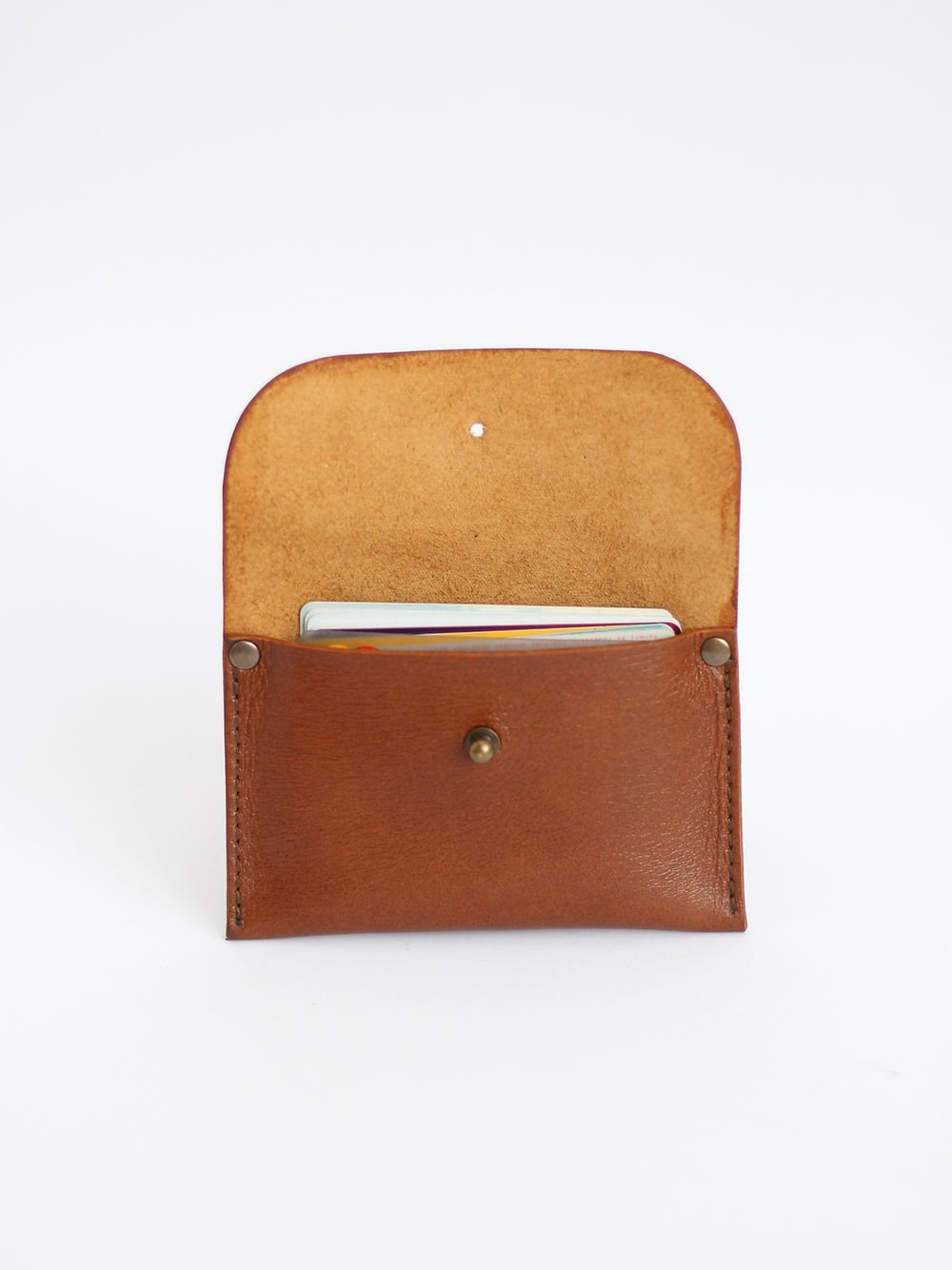 1. Open view of TOKS VISOKS WEEKEND Wallet in Ginger, showing card slots and recycled leather material