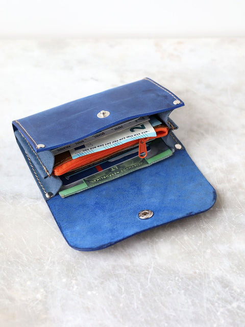2. Open TOKS VISOKS FRIDAY Wallet in blue, displaying spacious interior with cards and cash