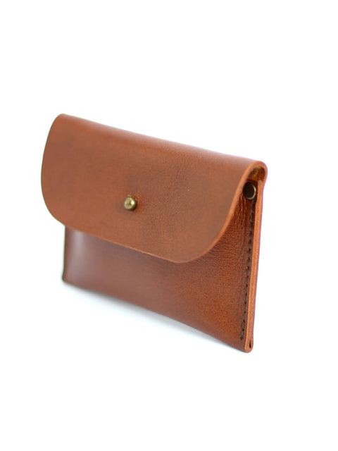 2. Side view of TOKS VISOKS WEEKEND Wallet in Ginger, highlighting compact design and recycled leather