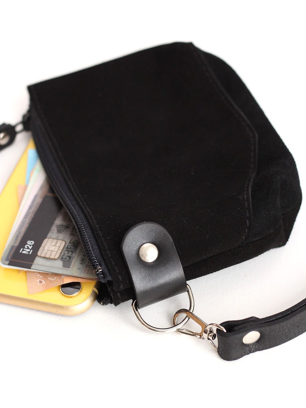 5. Black suede POUCH Wallet by TOKS VISOKS with cards visible, featuring secure zipper and wrist strap