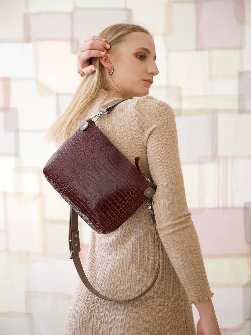 6. Women's TOMMY leather bag with crocodile pattern shown from back, highlighting texture and design
