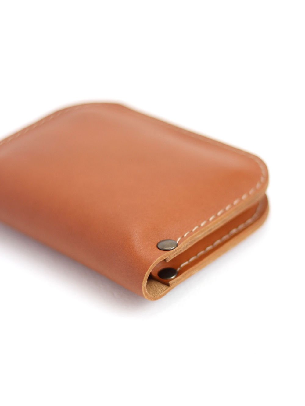 6. Close-up of SUNDAY Wallet in caramel by TOKS VISOKS, focusing on corner stitching and snap closure