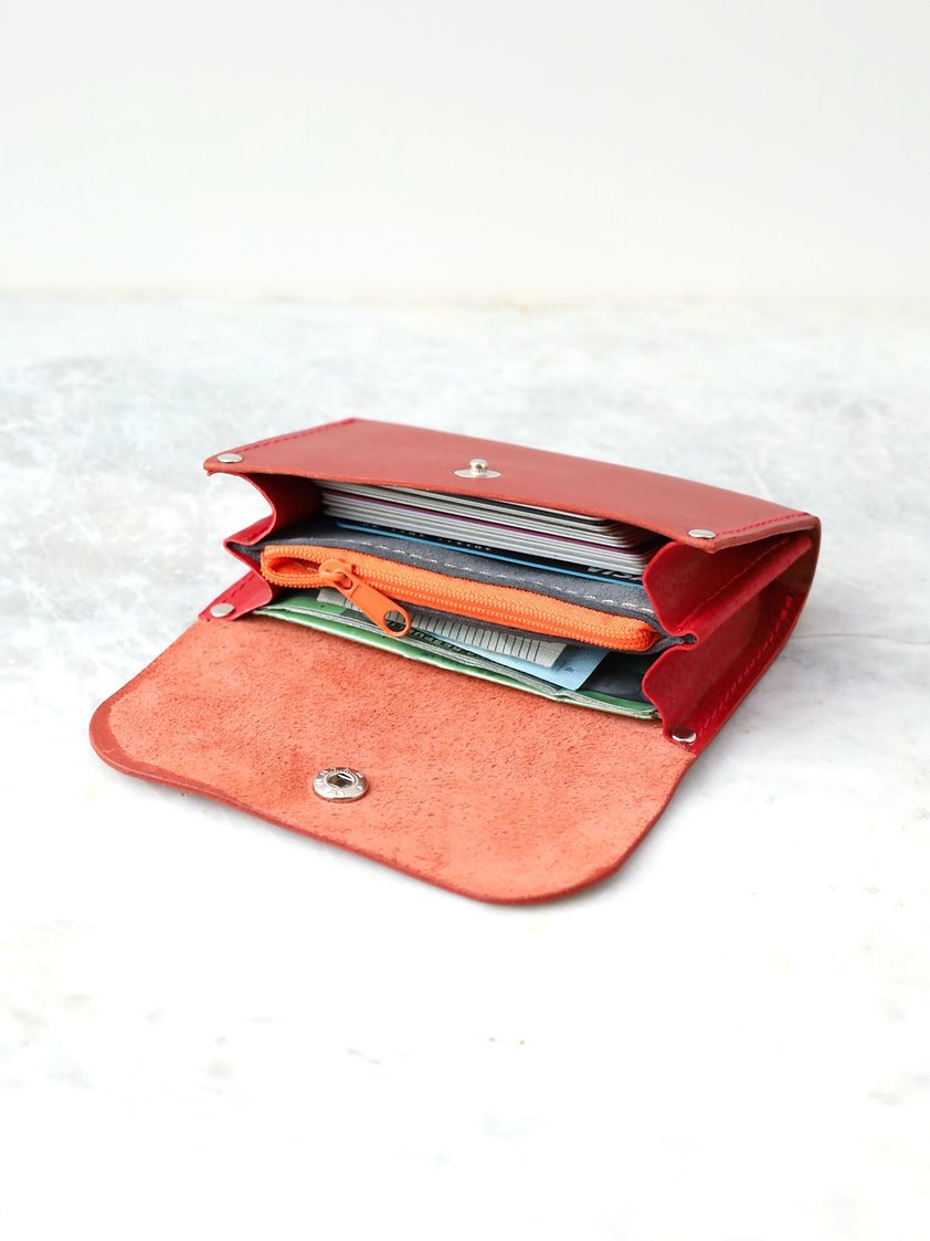 4. Open view of TOKS VISOKS FRIDAY Wallet in faded red, highlighting spacious interior and zipper pocket