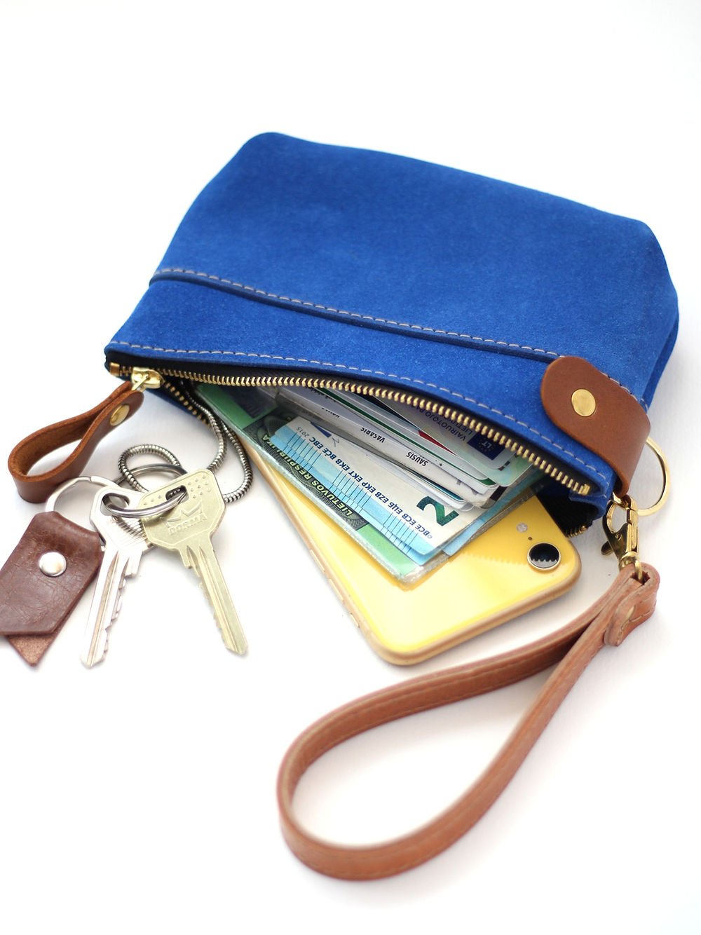 1. TOKS VISOKS blue suede POUCH wallet with removable wrist strap, shown with keys, phone, and cards inside