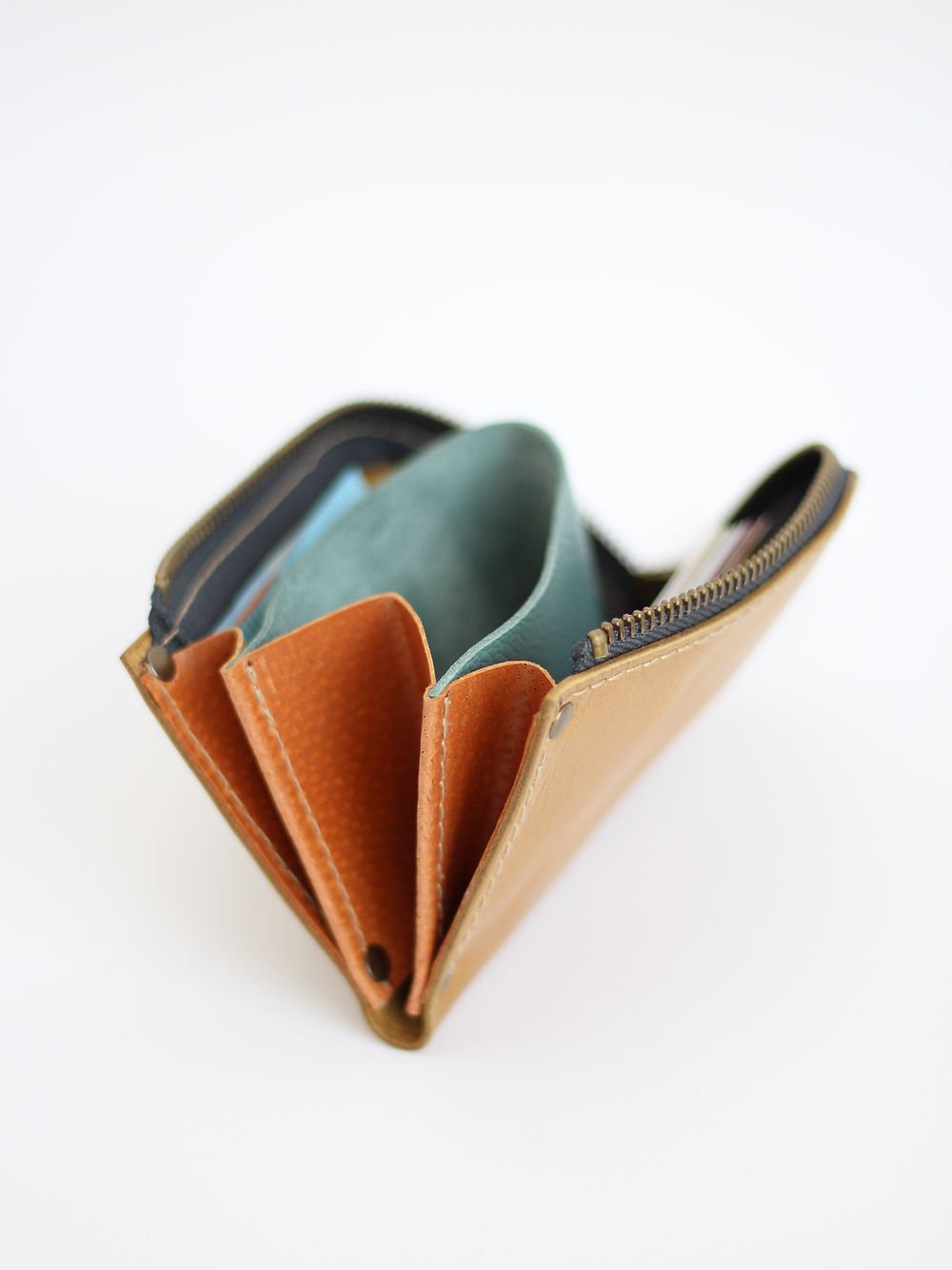 3. Side angle of TOKS VISOKS WEDNESDAY Wallet in mustard, highlighting recycled leather material