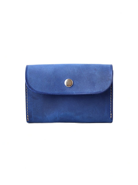 1. TOKS VISOKS FRIDAY Wallet in blue, handmade from recycled leather, shown closed with button clasp