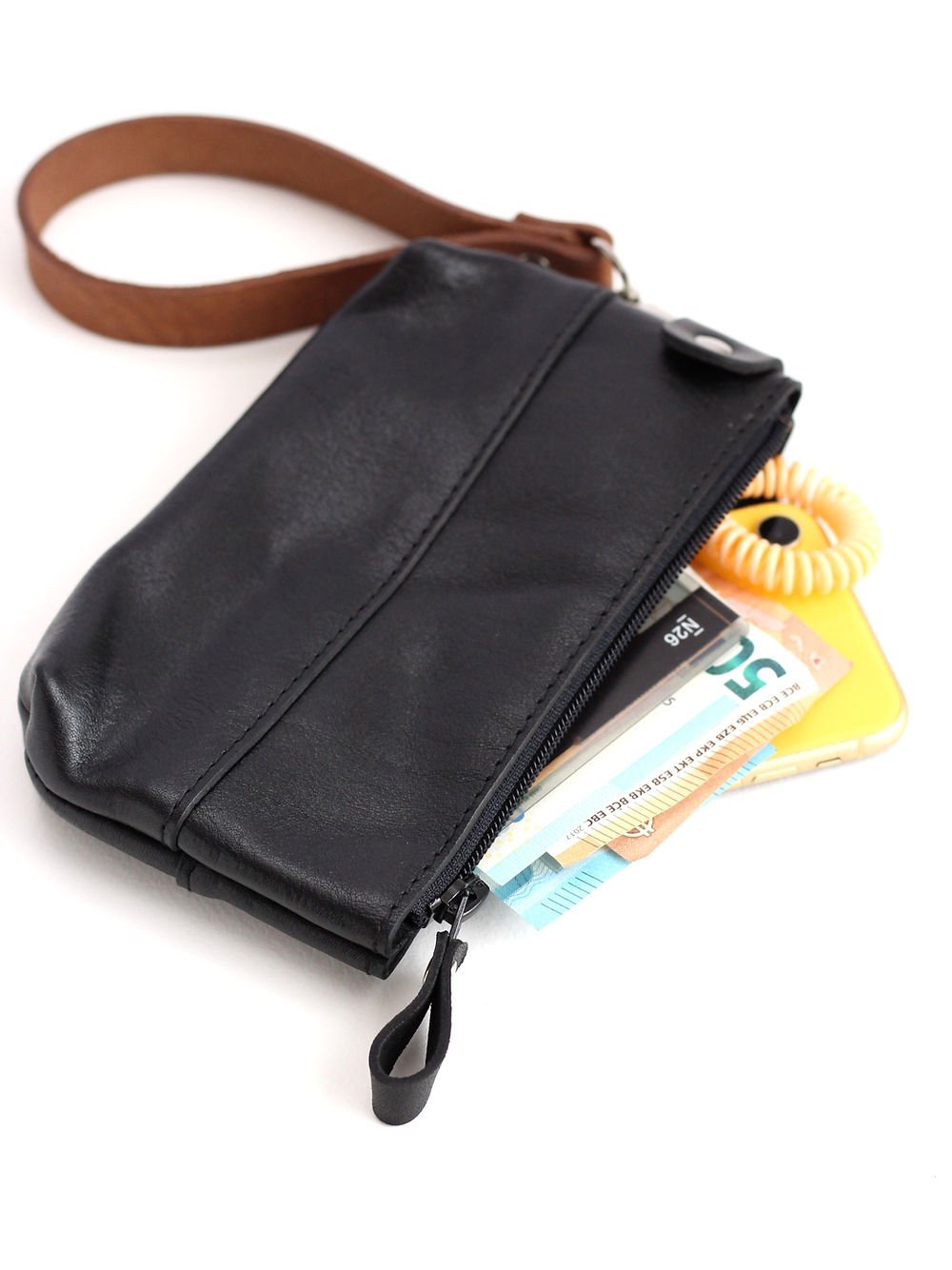 4. Close-up of TOKS VISOKS black POUCH wallet with visible contents and brown wrist strap