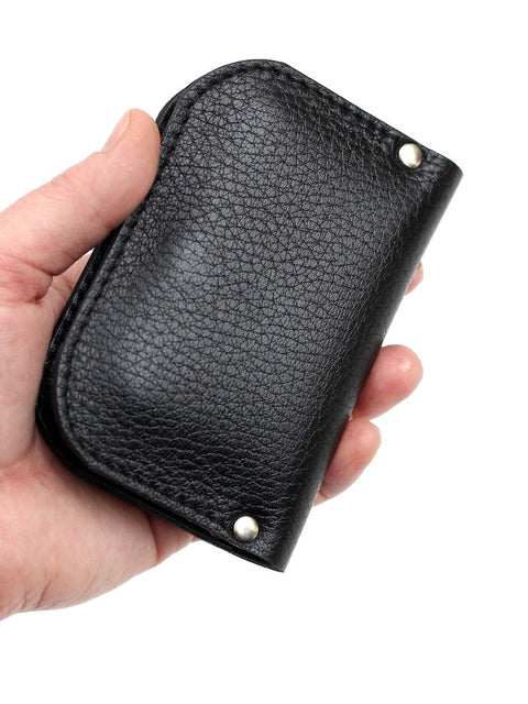 1. Black SUNDAY Wallet by TOKS VISOKS held in hand, showcasing recycled leather texture