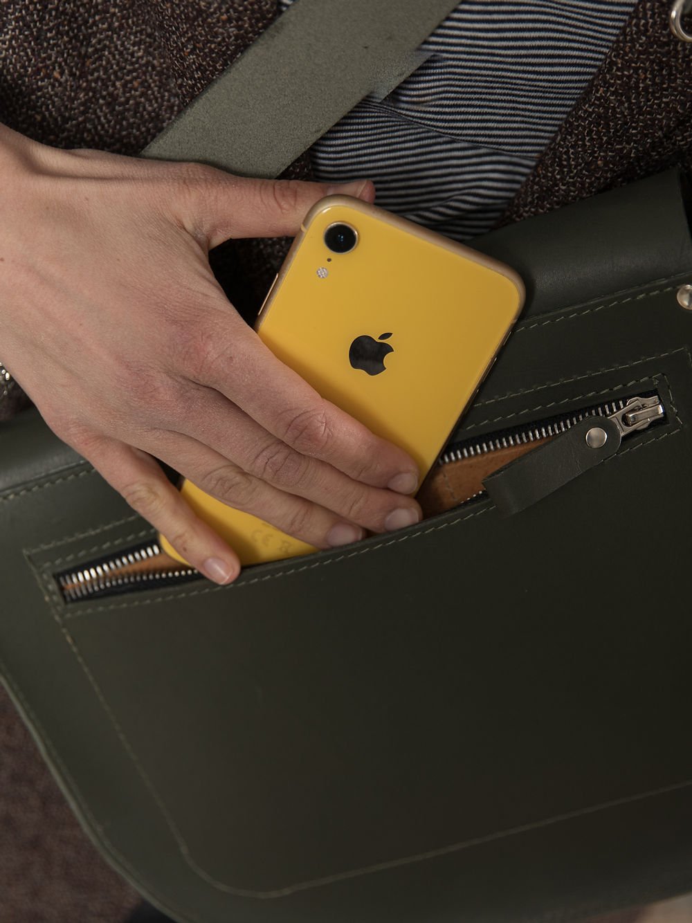 5. Close-up of TOKS VISOKS FIONA Handbag in faded green, showing secret back pocket with phone
