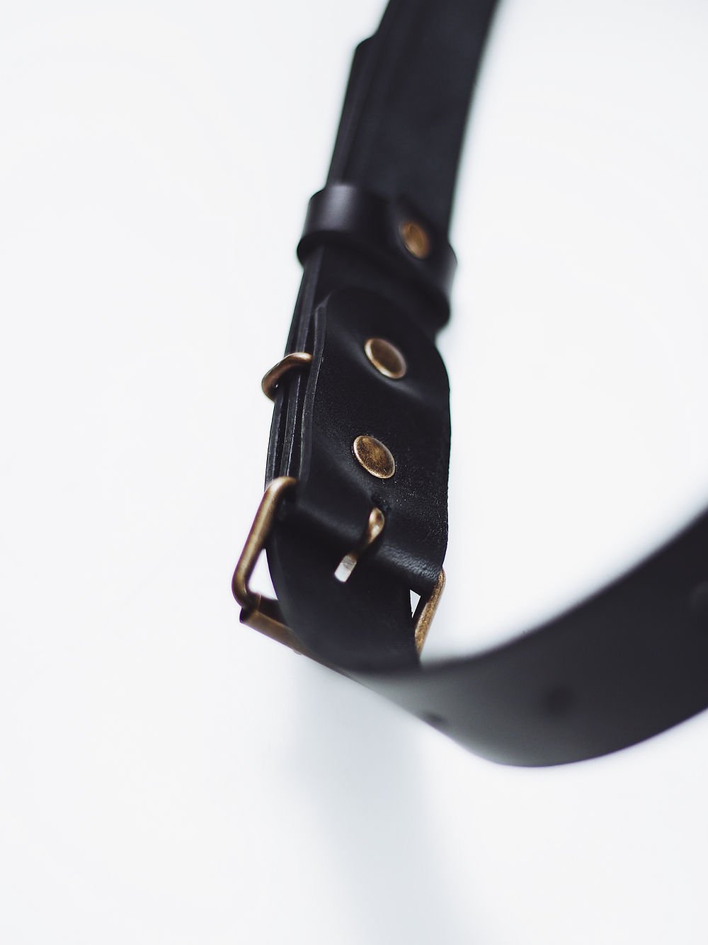 10. Close-up of black leather strap detail on BENJAMIN Backpack by TOKS VISOKS
