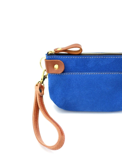 5. Close-up of TOKS VISOKS blue suede POUCH wallet, highlighting brown leather wrist strap and zipper detail