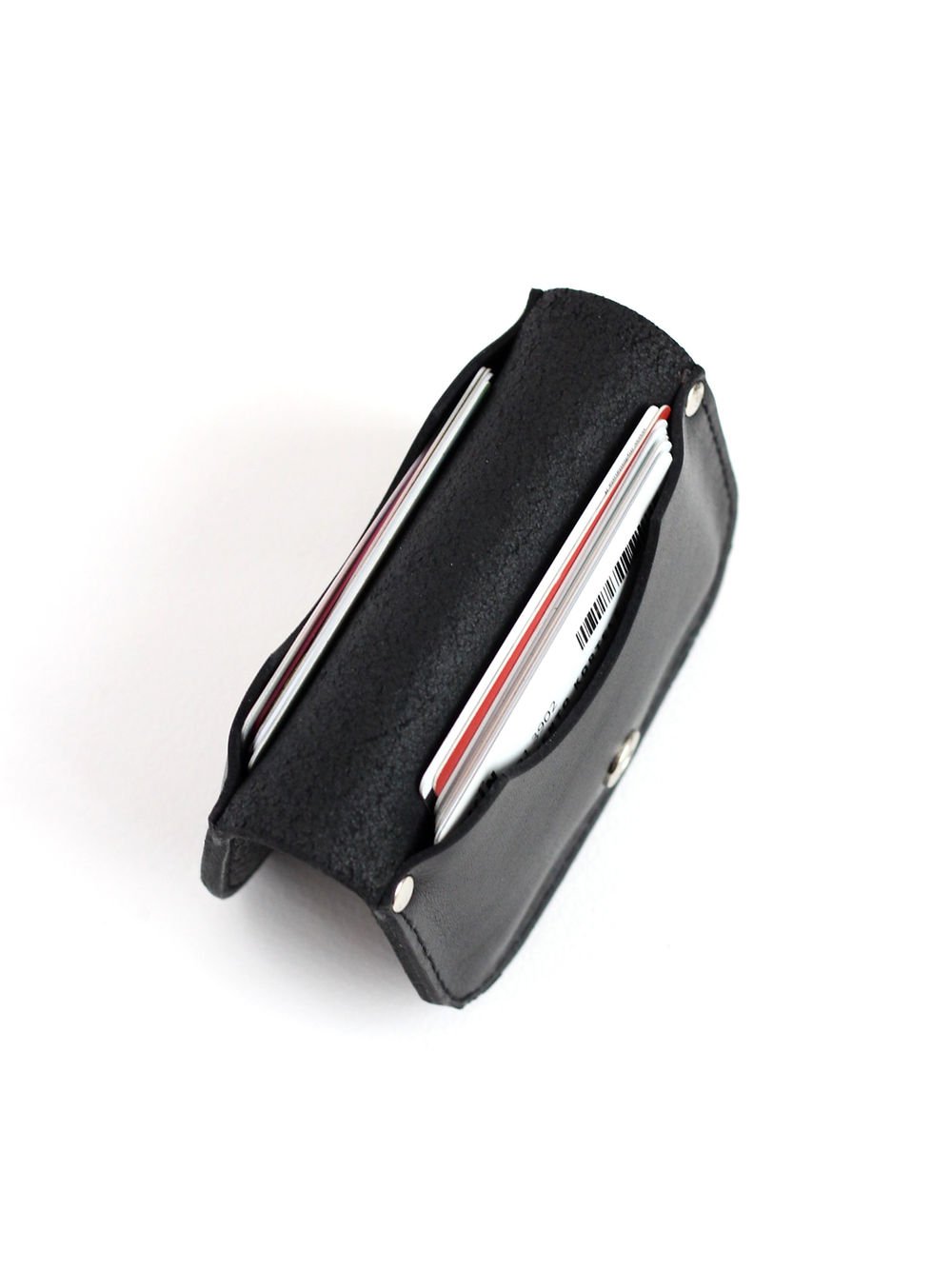 6. Top view of black SUNDAY Wallet by TOKS VISOKS with cards, showcasing interior capacity