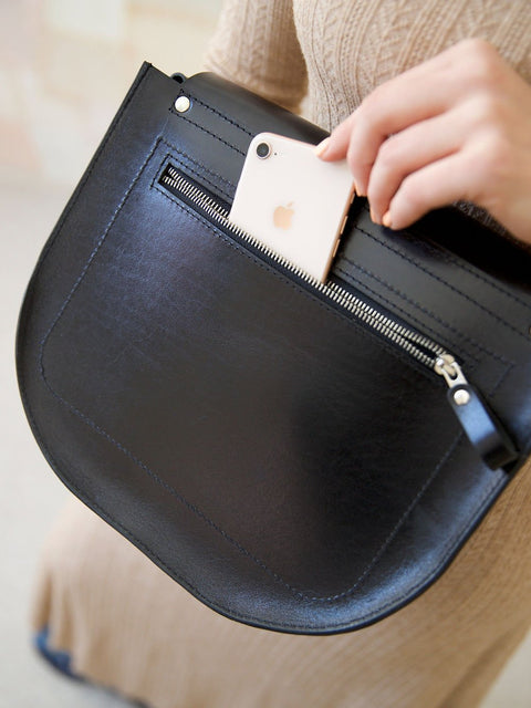 4. Close-up of TOKS VISOKS FIONA Handbag in black, showing secret back pocket with phone