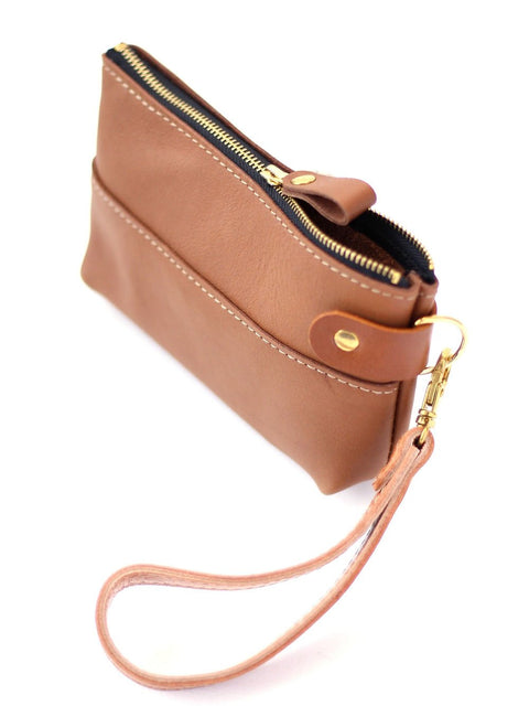 3. Studio shot of TOKS VISOKS camel brown leather POUCH Wallet with zipper closure and wrist strap