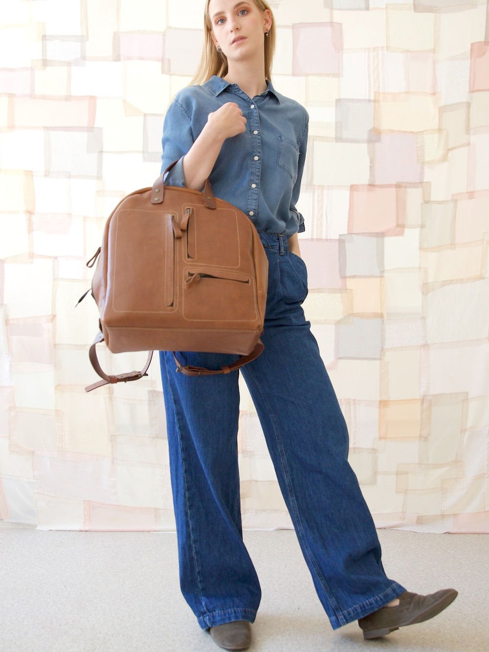 6. Woman posing with TOKS VISOKS GORDON Backpack in Capuccino, lifestyle setting