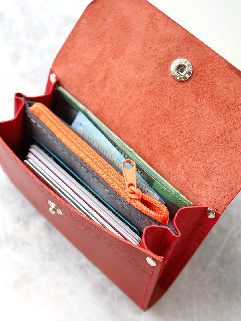 8. Detailed view of open TOKS VISOKS FRIDAY Wallet in faded red, showing card and cash organization