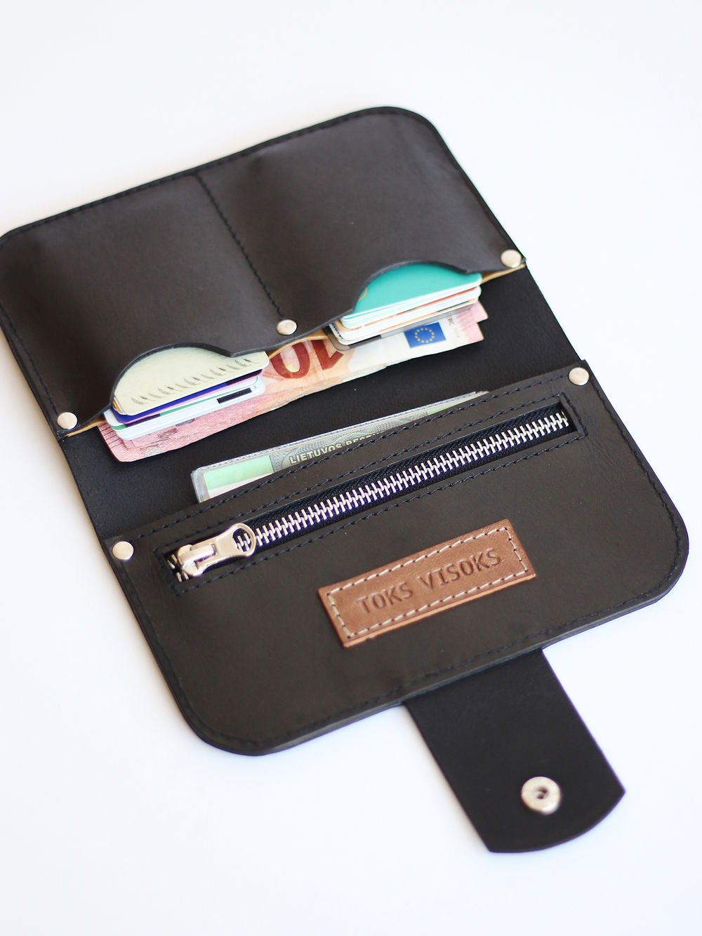 3. Open black SATURDAY wallet by TOKS VISOKS, displaying spacious interior with card slots and zipper pocket