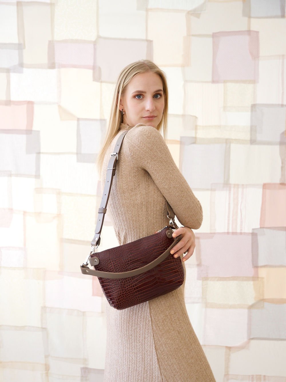 5. Women's TOMMY leather bag with crocodile pattern worn crossbody by model, back view